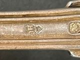 a close up of a silver object on a table