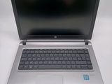 an open laptop computer sitting on top of a white table