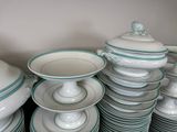 a lot of plates and bowls stacked on top of each other