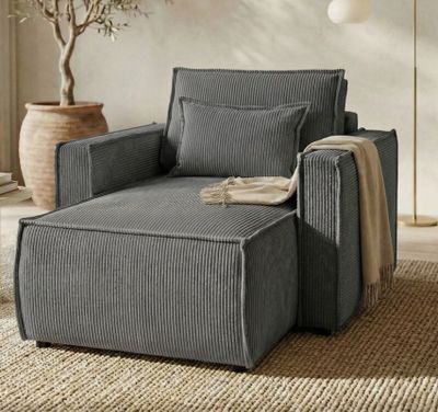 an image of a chair and ottoman in a living room