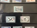 the collection of stamps are on display in a display case