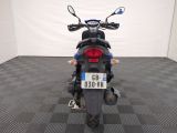a motorcycle that is parked in a room with a checkered floor