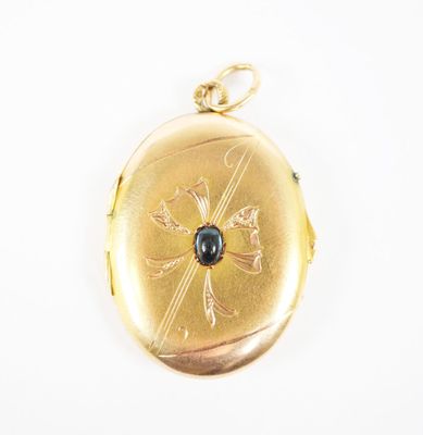an image of a gold locke with a blue stone in the center