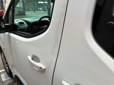 a white van that is parked on the side of the street