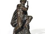 bronze statue of a man holding a gun on a white background