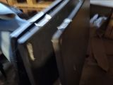 a black stove sitting in the middle of a room