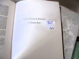 an open book with a sticker on it sitting on a table