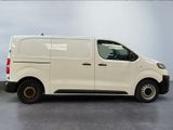 a picture of a white van parked in a parking lot