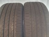 two tires on a white surface with a white background