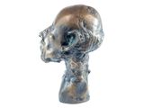 a silver sculpture of a man ' s head on a white background