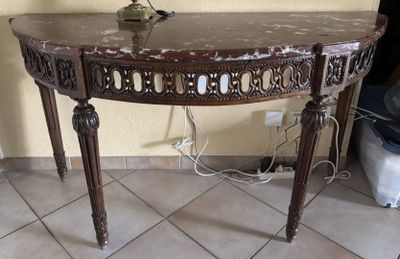 a small table with a vase on top of it