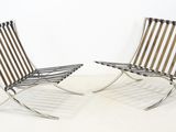 pair of lounge chairs designed by mies van deren