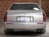 a silver car parked in a garage with a license plate on the back