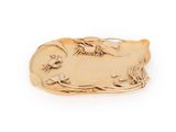 an image of a gold plate with a bird and flowers on it