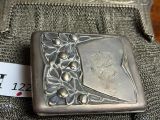 a silver box with a picture on it sitting on a table