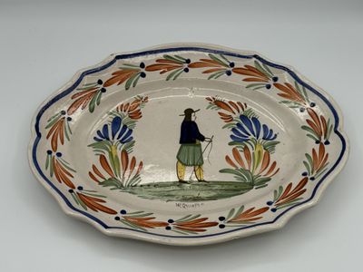 a plate with a picture of a man holding a golf club