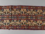 an old rug with a design on it on a white surface