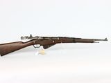 an old rifle with a wooden barrel on a white background