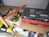 a tool box and tools on a shelf in a garage