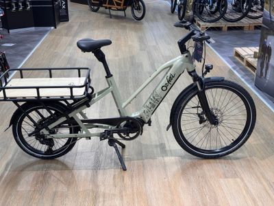 a bike with a basket on the back of it in a store