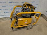 une image représentant une machine jaune surmontée d'un tuyau