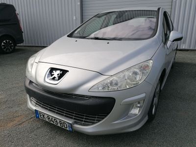 a silver car parked in front of a building