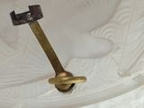 a glass plate with a brass handle on it