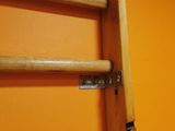 an image of a wooden ladder hanging on a wall