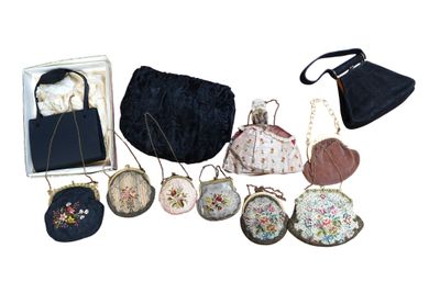 many purses that are sitting on a white surface