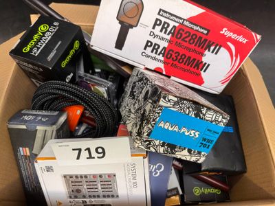a cardboard box filled with electronics and other items