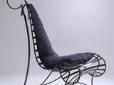 an image of a chair with a blue cushion on it