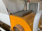 a machine that is sitting on a pallet in a warehouse