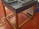 a workbench that has a bunch of tools on it