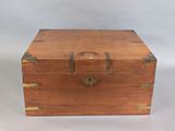 a small wooden box that has a lock on it