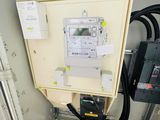 an electrical panel with wires and wires attached to it