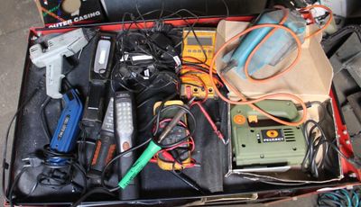 a box full of electrical equipment that is sitting on the floor