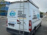 a white van that is parked in a parking lot