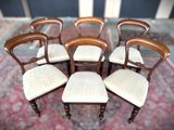 six chairs that are sitting on a rug on the floor