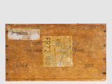 an old wooden box with a label on it