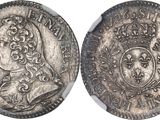 a silver coin with an image of a woman on it