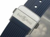 a close up of a wrist watch with a blue band