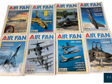 six magazine covers of air fans and fighter jets on a white surface