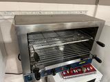 an image of a toaster oven with a bunch of food inside of it