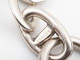 an image of a close up of a metal chain on a white surface