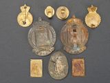 some of the medals are on display on a black surface