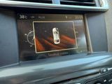 a picture of a car ' s dashboard with a cell phone in it