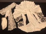 a black table with a black cloth and white lace on it