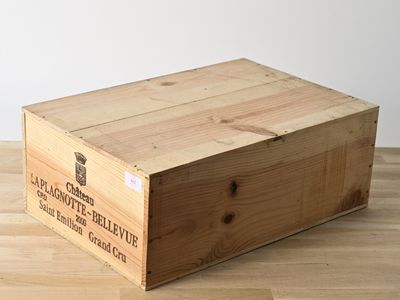 a wooden box that is sitting on a wooden floor