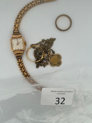 two watches and a ring on display in a display case