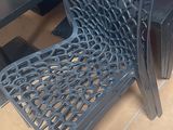 a black chair that is sitting in front of a table